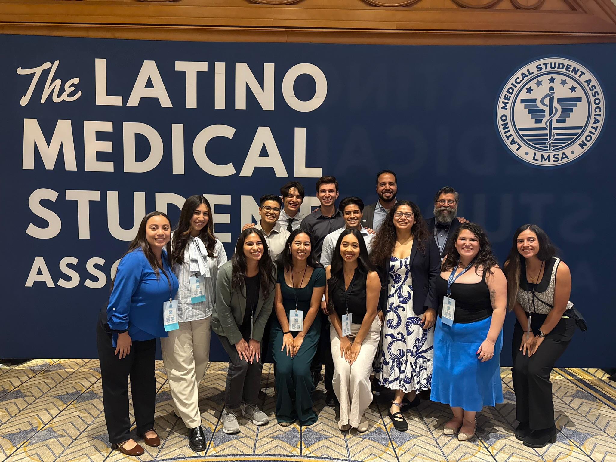 Group in front of the blue Latine Medical Student Association banner at the 2025 National Conference.